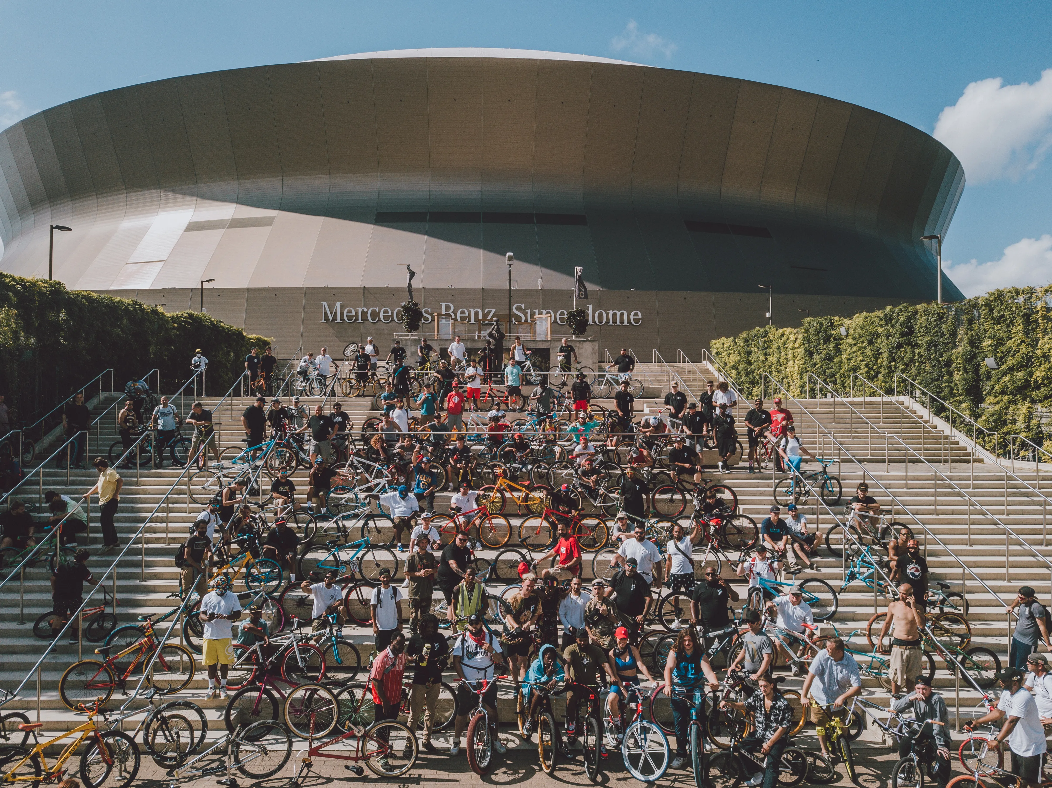 1Up Bike Life crew packed across the steps of the Caesars Superdome with their bikes